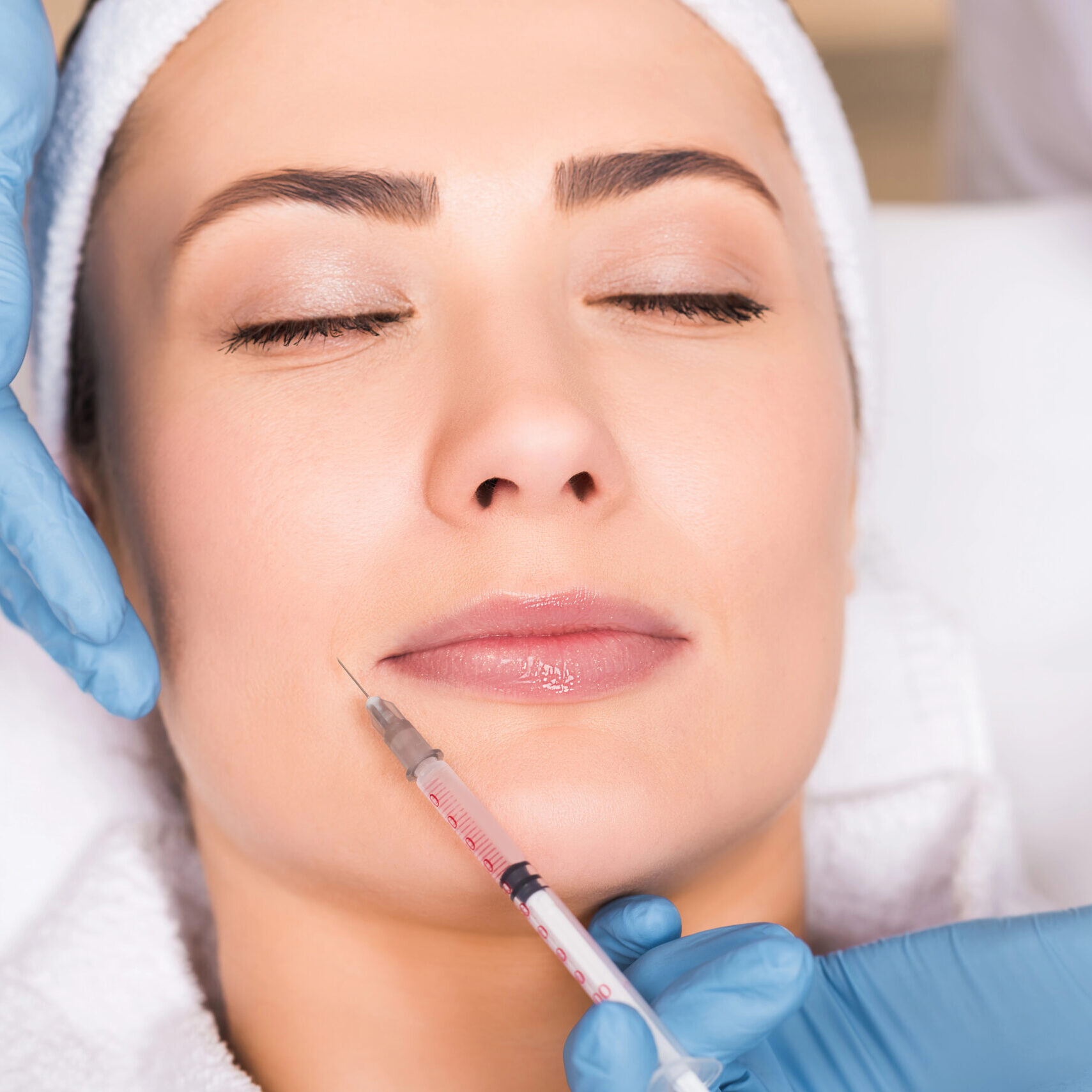 Woman receiving Botox injection in face at Boost Beauty Boutique a med spa in Columbia IL near Waterloo IL and St. Louis MO