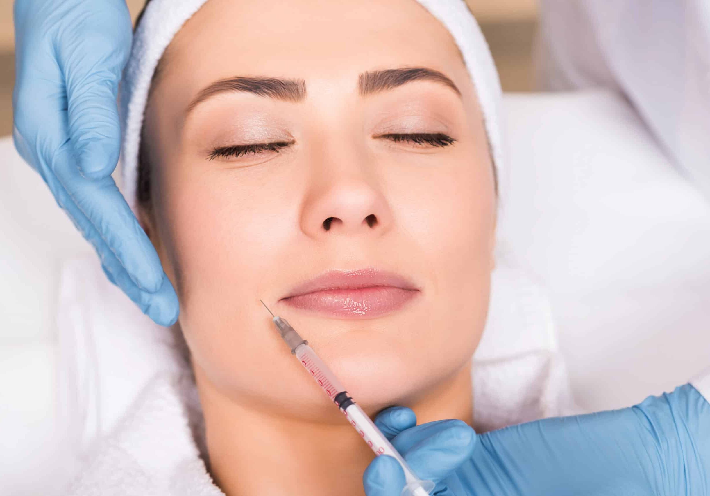 Woman receiving Botox injection in face at Boost Beauty Boutique a med spa in Columbia IL near Waterloo IL and St. Louis MO