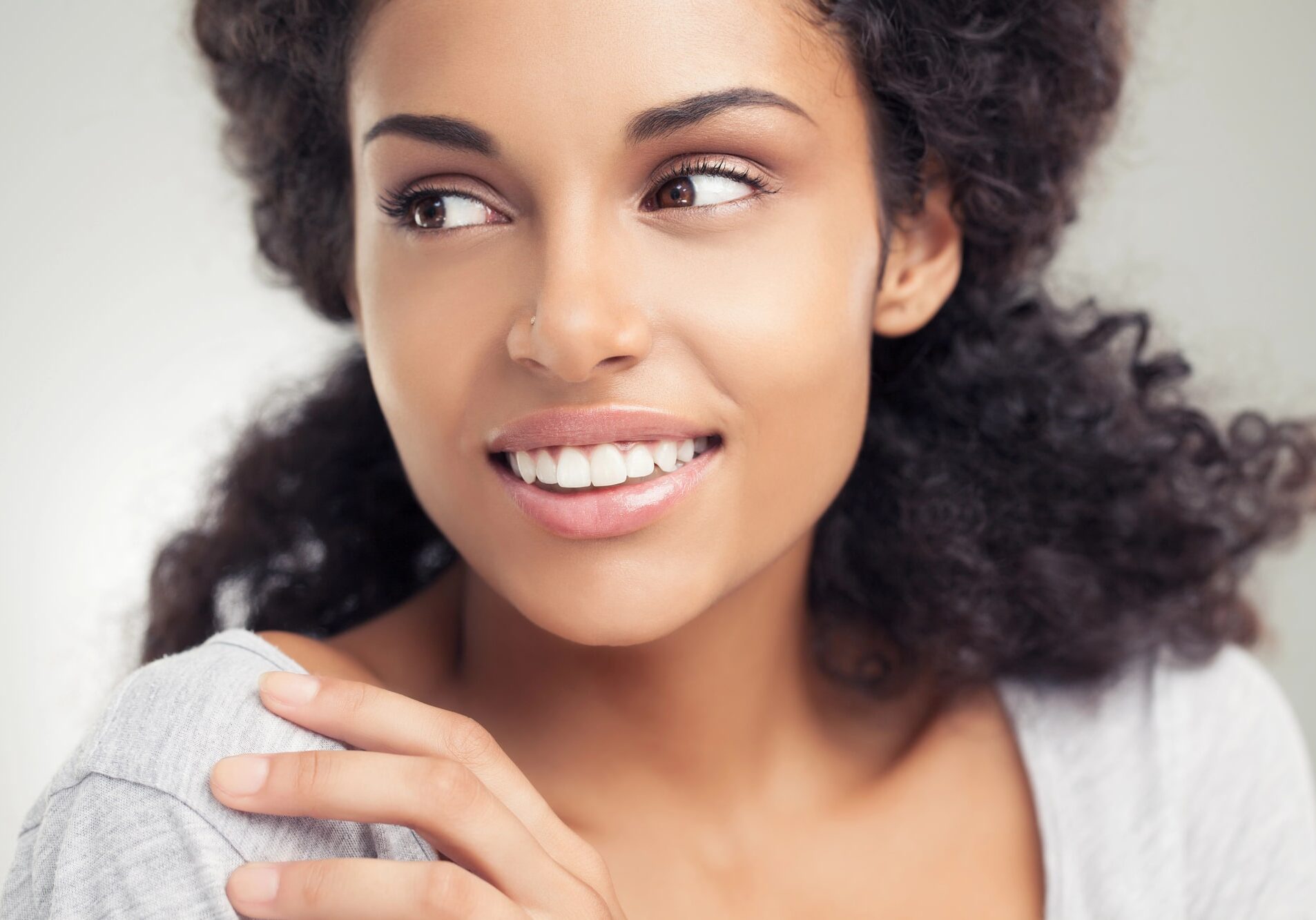 Woman with glowing skin after Virtue RF Microneedling at Boost Beauty Boutique in southern Illinois