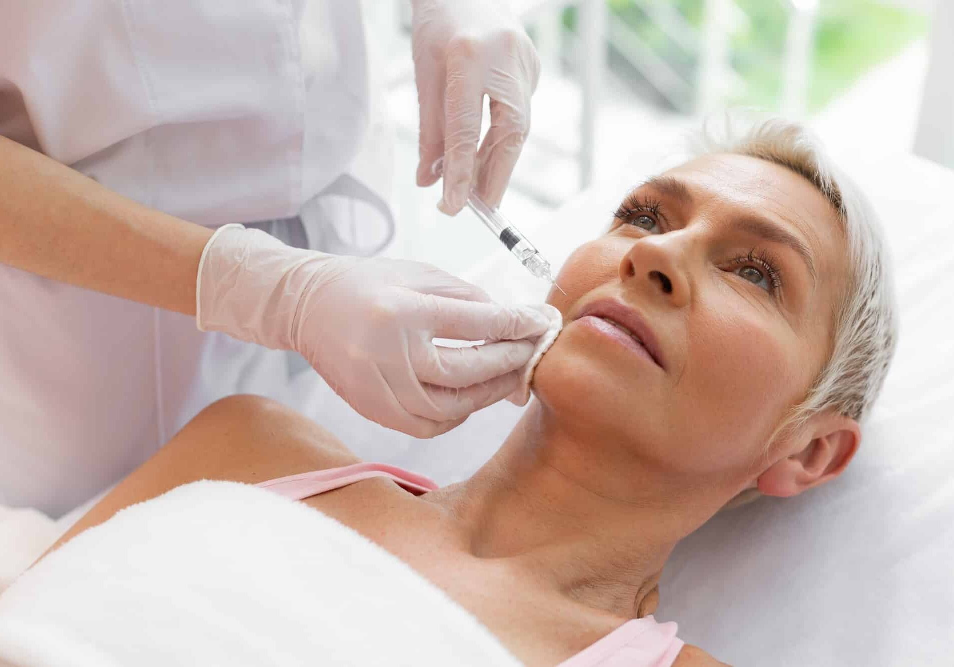 Woman receiving injectables like Jeuveau or Xeomin at Boost Beauty Boutique in Columbia IL